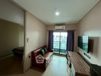 Modern living room with city view, sleek furniture, and balcony access in a stylish apartment.