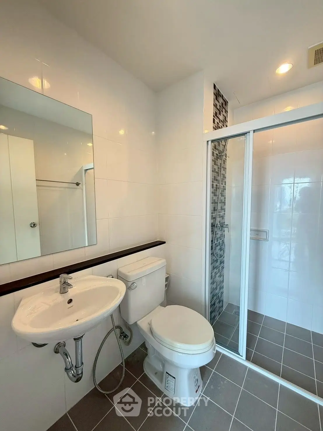 Modern bathroom with glass shower and sleek fixtures