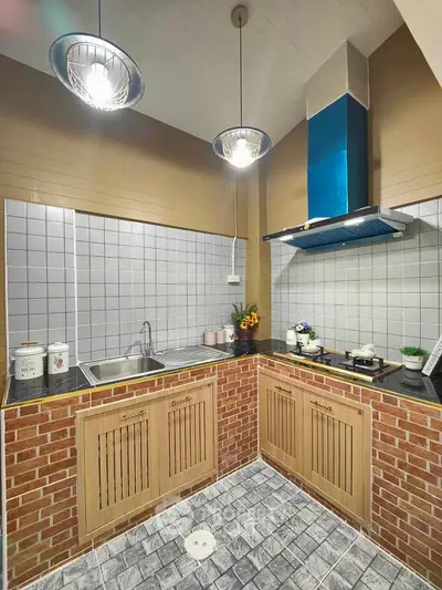 Charming kitchen with brick accents and modern lighting