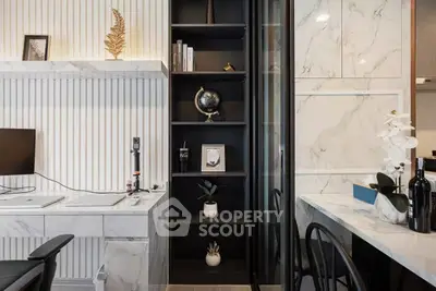 Modern study area with marble desk and elegant shelving in luxury apartment