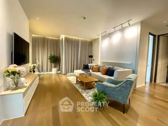 Spacious modern living room with elegant decor and wooden flooring