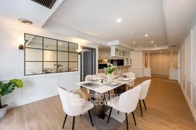 Elegant dining area with modern decor and open layout, perfect for entertaining guests.