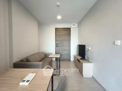 Modern living room with sleek furniture and neutral tones, perfect for urban living.