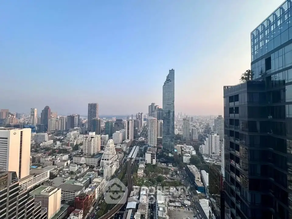 Stunning cityscape view from high-rise building showcasing urban skyline and modern architecture.