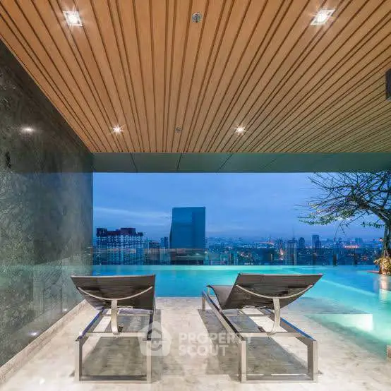 Luxurious rooftop infinity pool with stunning city skyline view