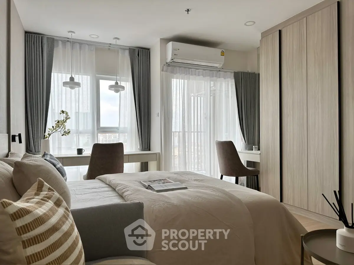 Modern bedroom with large windows and stylish decor