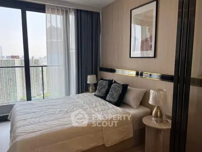 Modern bedroom with city view and stylish decor in high-rise apartment