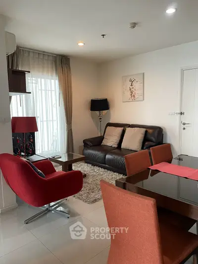 Stylish living room with modern furniture and natural light in a contemporary apartment.