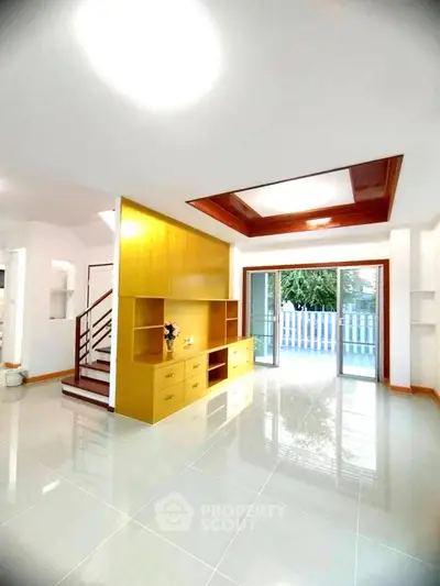 Spacious modern living room with open layout and large windows