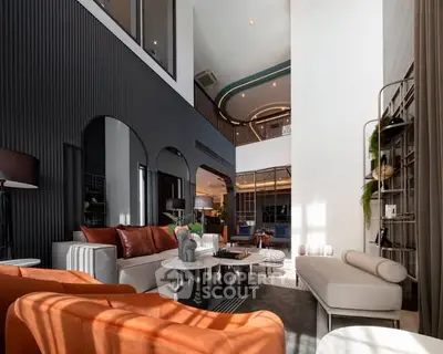 Luxurious modern living room with high ceilings and elegant decor