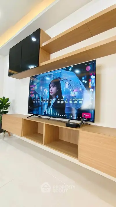 Modern living room with sleek TV unit and stylish shelving