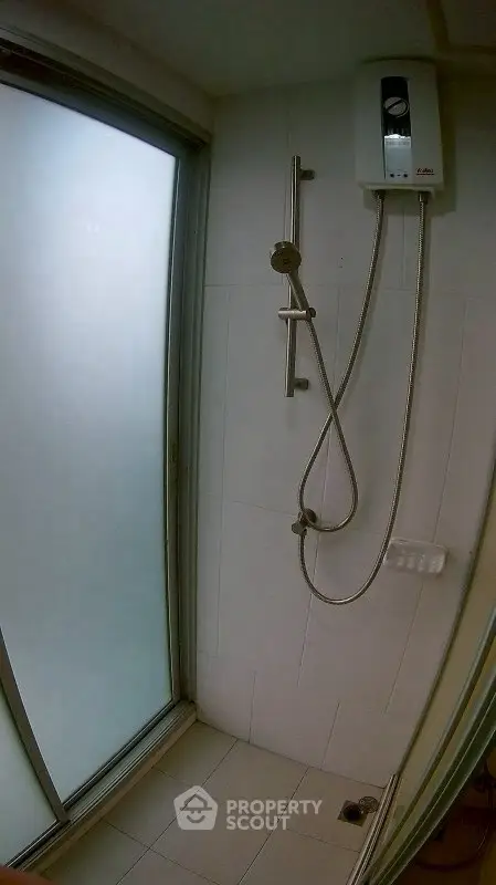 Modern bathroom with sleek shower and frosted glass door