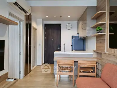 Modern kitchen with open layout and wooden accents in a cozy apartment.