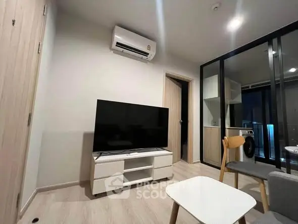 Modern living room with sleek furniture and air conditioning in a stylish apartment.