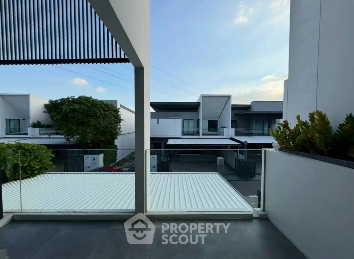 Modern residential view with sleek architecture and spacious balcony.