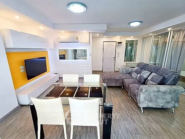 Modern living room with stylish furniture and open layout, perfect for entertaining.