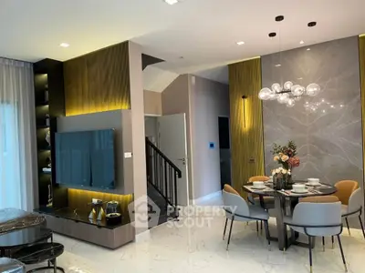 Modern living room with stylish dining area and elegant lighting