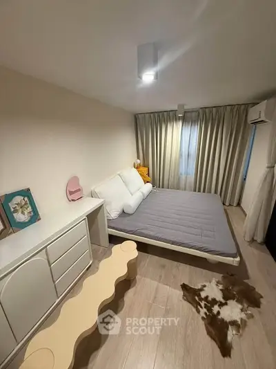 Cozy bedroom with modern decor and natural light