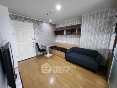 Modern living room with stylish wallpaper and cozy seating area