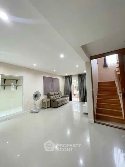 Spacious modern living room with sleek design and natural light