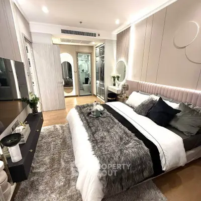 Luxurious bedroom with modern decor, plush bedding, and ambient lighting for ultimate comfort and style.