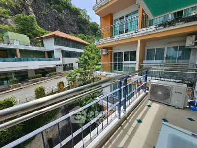 Spacious balcony with scenic view in modern residential complex