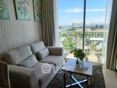 Charming living room with cozy sofa and stunning balcony view in modern apartment.
