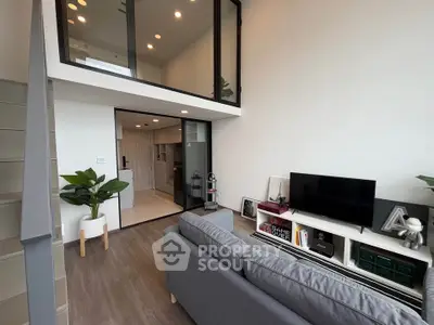 Modern loft apartment with stylish living room and open kitchen layout