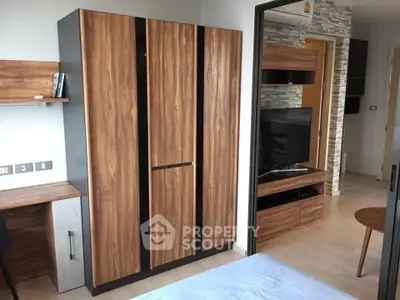 Modern bedroom with wooden wardrobe and TV unit, stylish interior design