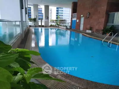 Luxurious high-rise condominium with stunning pool and modern amenities.