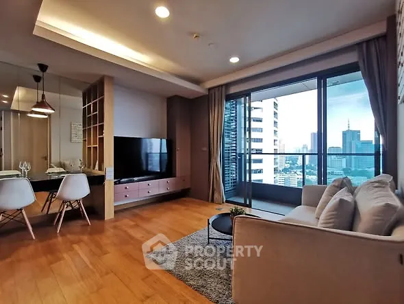 Modern living room with city view and spacious balcony in luxury apartment