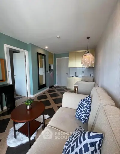 Chic modern living room with stylish decor and open kitchen layout in a cozy apartment.