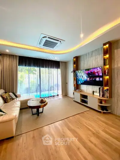 Luxurious living room with modern decor and pool view, featuring elegant lighting and spacious layout.