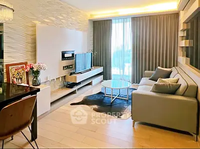 Modern living room with stylish decor, large window, and cozy seating area.