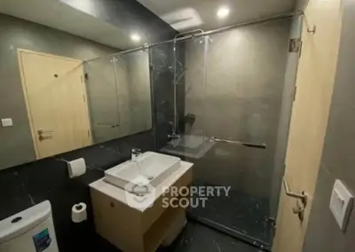 Modern bathroom with sleek design and glass shower enclosure