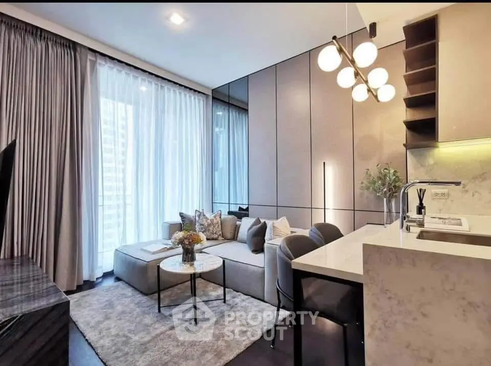 Modern living room with elegant decor and open kitchen layout