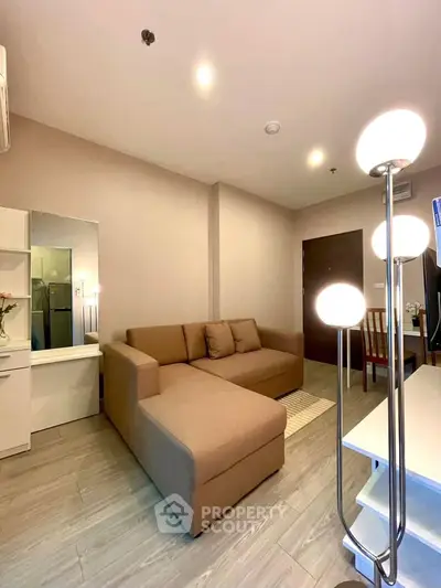 Modern living room with cozy brown sofa and stylish lighting