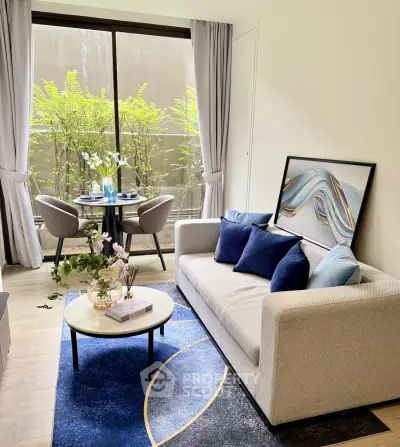 Stylish living room with modern decor and large window view of greenery.
