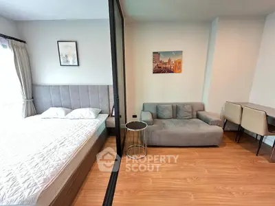 Modern studio apartment with cozy living area and stylish decor