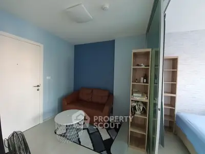 Cozy living room with modern decor and blue accent wall