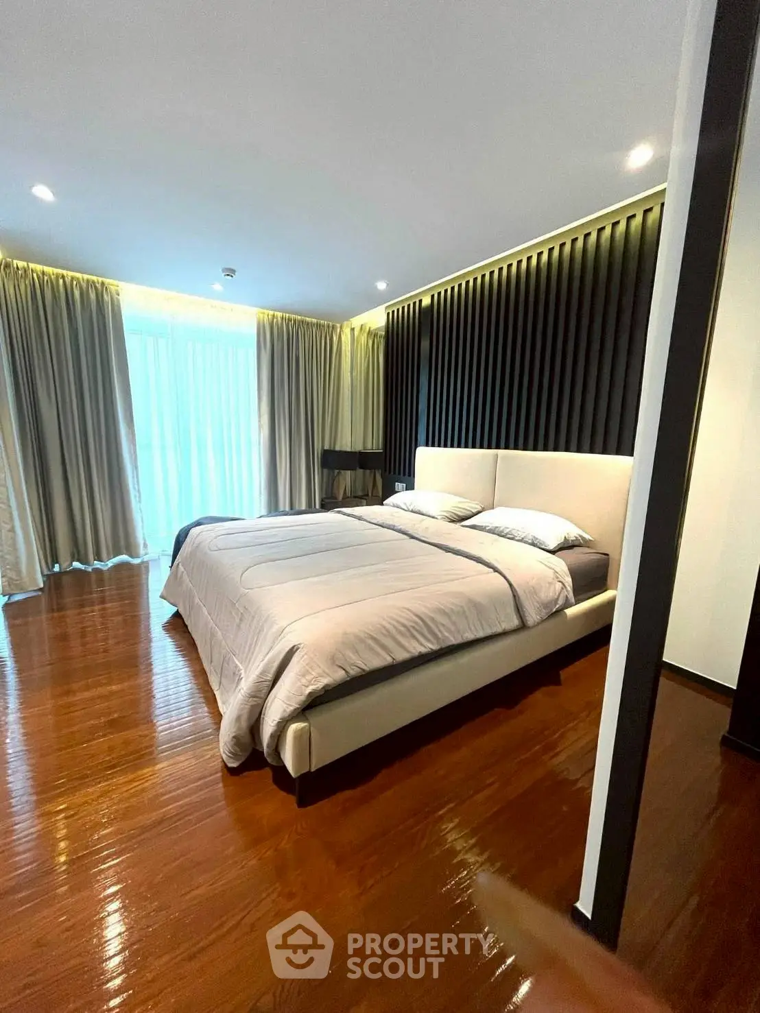 Luxurious bedroom with elegant design and large windows for natural light