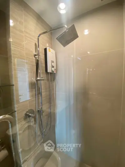 Modern bathroom with sleek shower and water heater