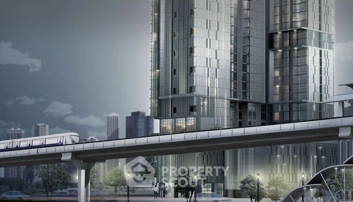Modern high-rise building with sleek design and urban transit view, perfect for city living enthusiasts.