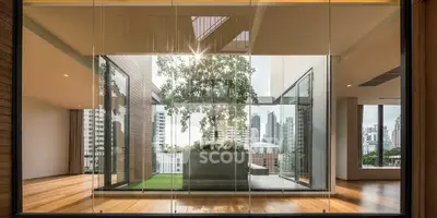 Luxurious modern apartment with floor-to-ceiling windows and stunning city view