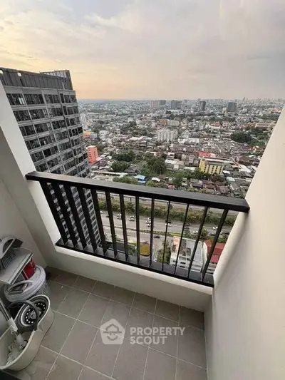 Stunning high-rise balcony with panoramic city view, perfect for urban living enthusiasts.