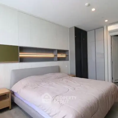 Modern bedroom with sleek design and ample storage space