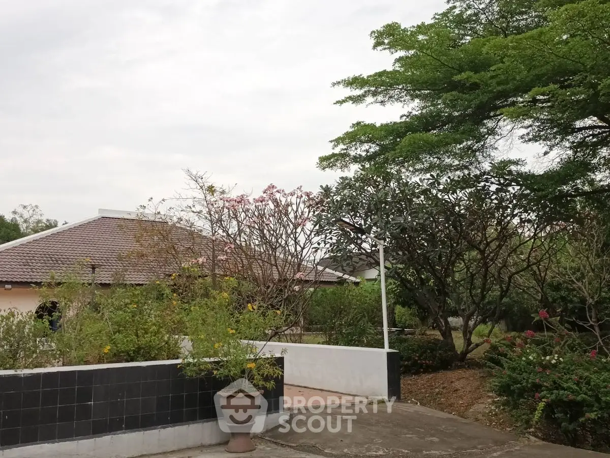 Charming suburban home with lush garden and mature trees, perfect for nature lovers.