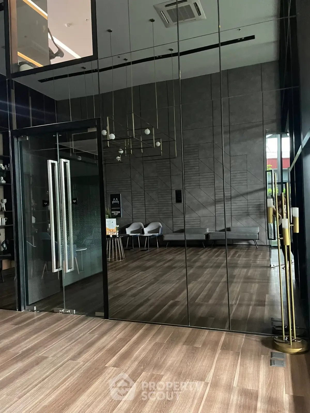 Modern building entrance with sleek glass doors and stylish interior design