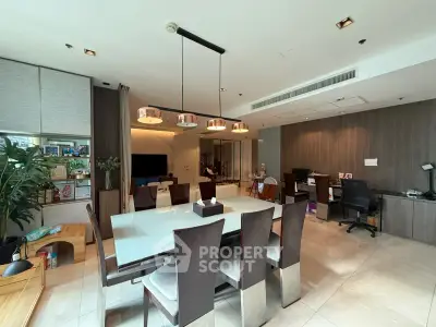 Spacious modern dining room with elegant table and chairs, perfect for entertaining guests.