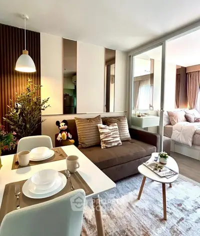 Modern living room with cozy dining area and stylish decor in a contemporary apartment.